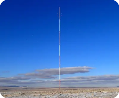 large pole in the middle of a desert landscape