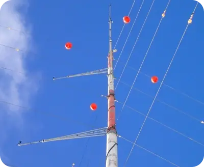 Upward view of pole with connecting wires.